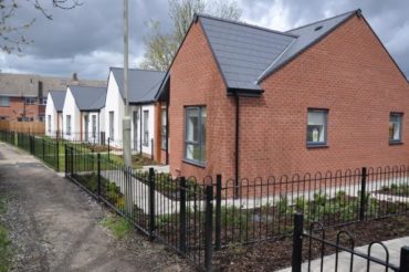 Painswick Road bungalows, side on view, looking down path