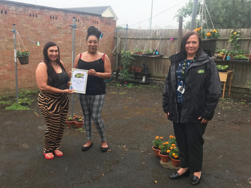 Natalie, Shellene and Housing Officer Karen stood in garden