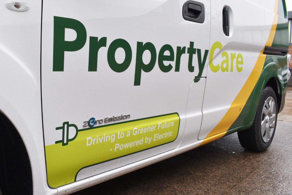 Image of green strapline on van side