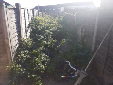 Clearing an unsafe bramble-filled alleyway in Tredworth - before