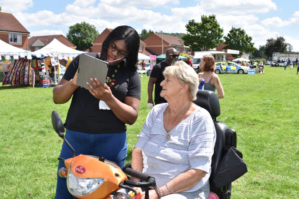 Talking to a local resident at Podsmead Windrush Event
