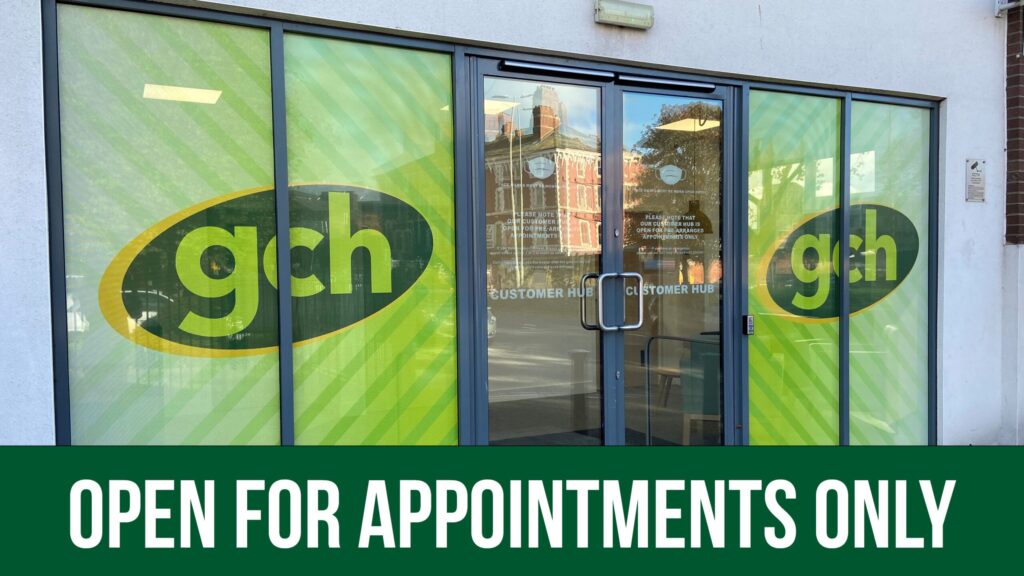 View of GCH office with text announcing that we are open for appointments only