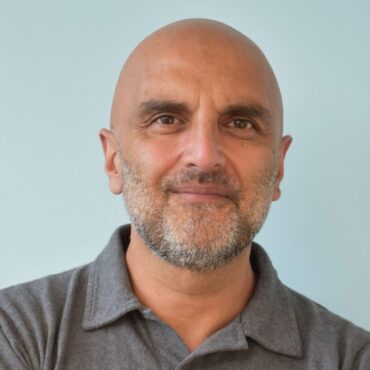 A photo of Chair of the Board Asif Bhatti