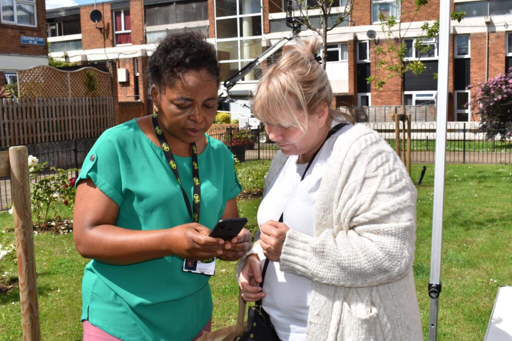 A member of GCH staff conducting a survey with a tenant