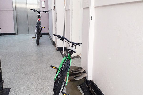 Cluttered communal area with bikes