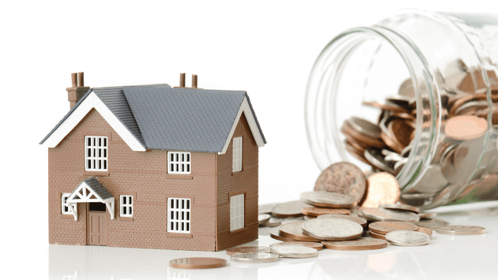 model of house with jar of coins