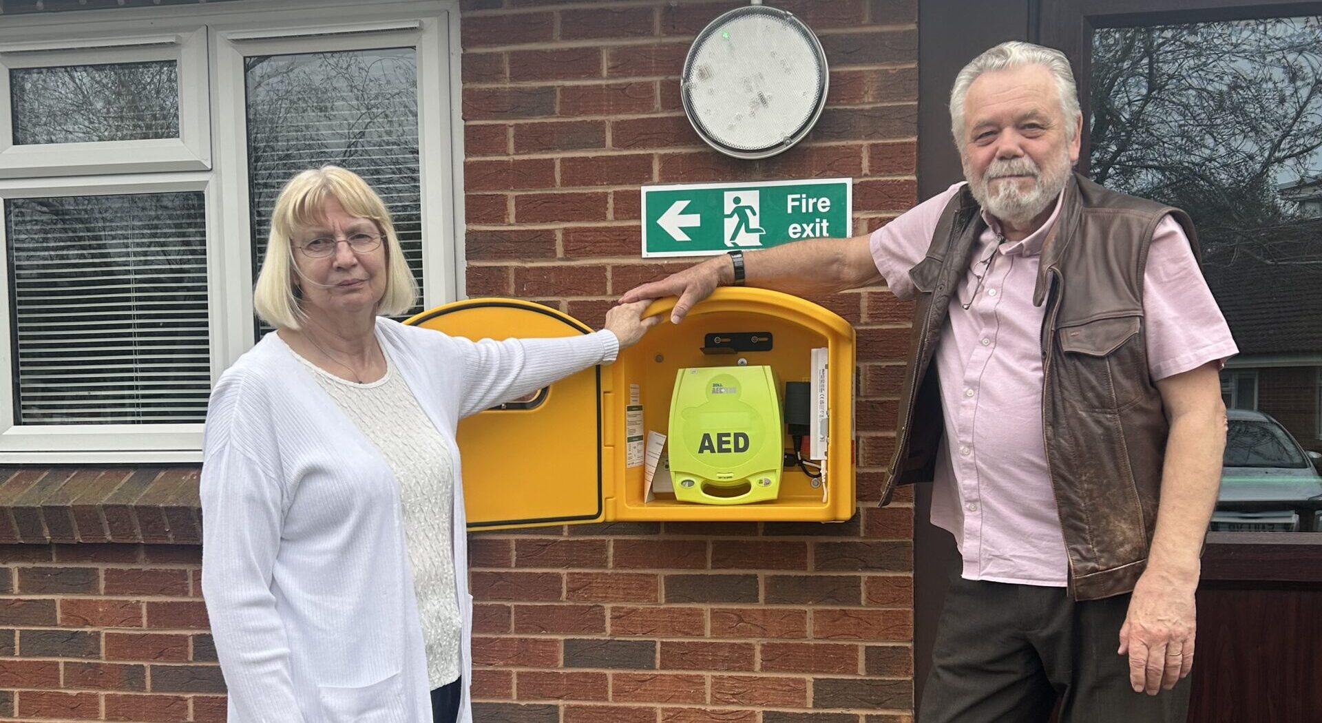 Mr and Mrs Marlow with the defibrilator at Badger Vale