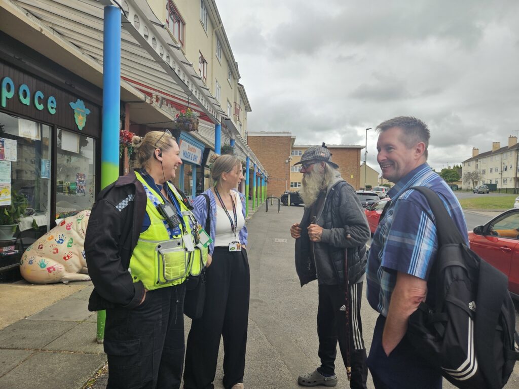 Image shows GCH colleagues and local PCSO chatting to a local Matson resident outside The Ewe Space