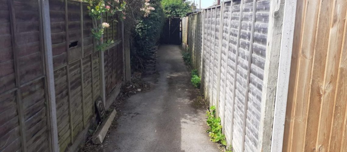 Clearing an unsafe bramble-filled alleyway in Tredworth - after